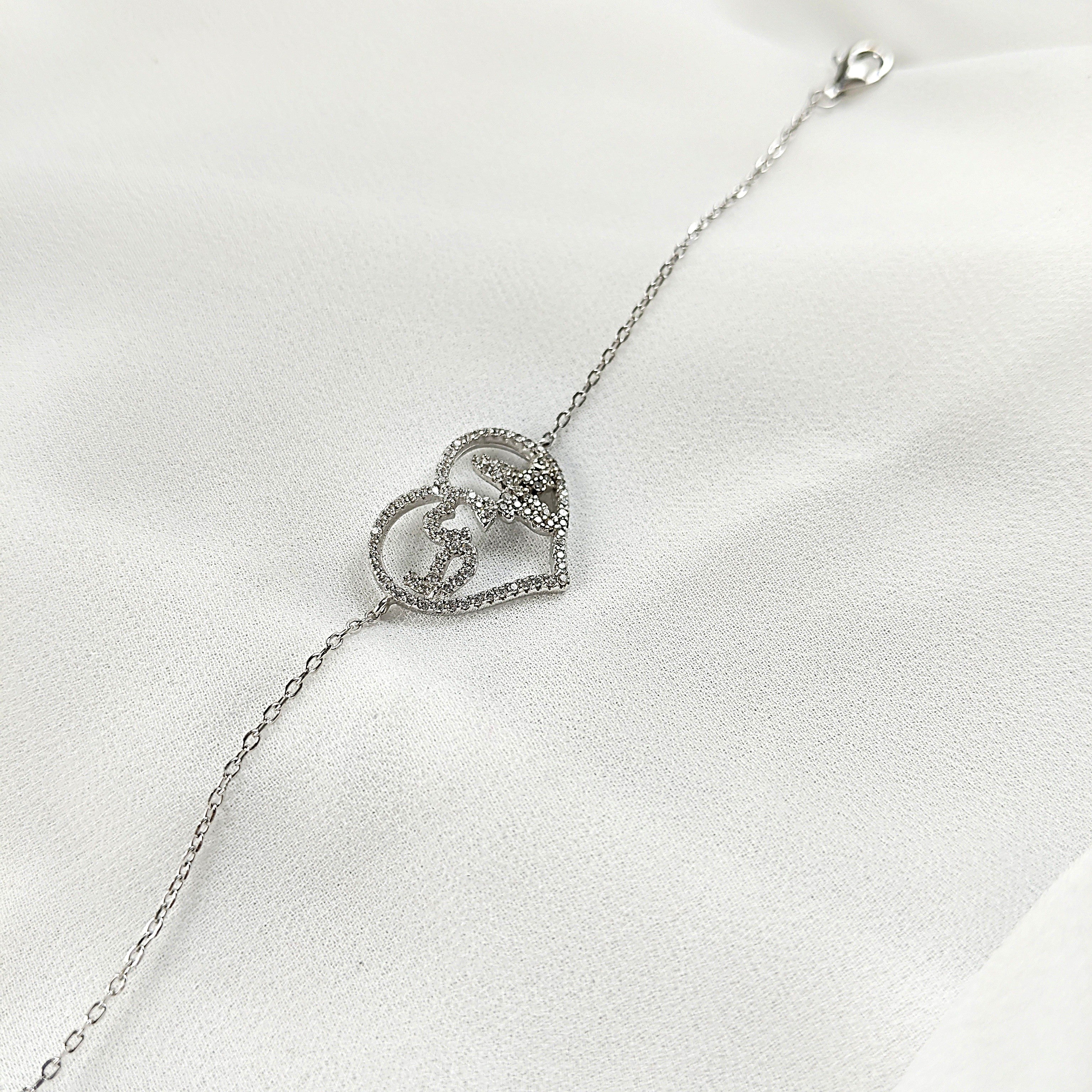 Gourmette en Argent 925 avec Double Cœur Entrelacé Gourmette en Argent 925 avec Double Cœur Entrelacé