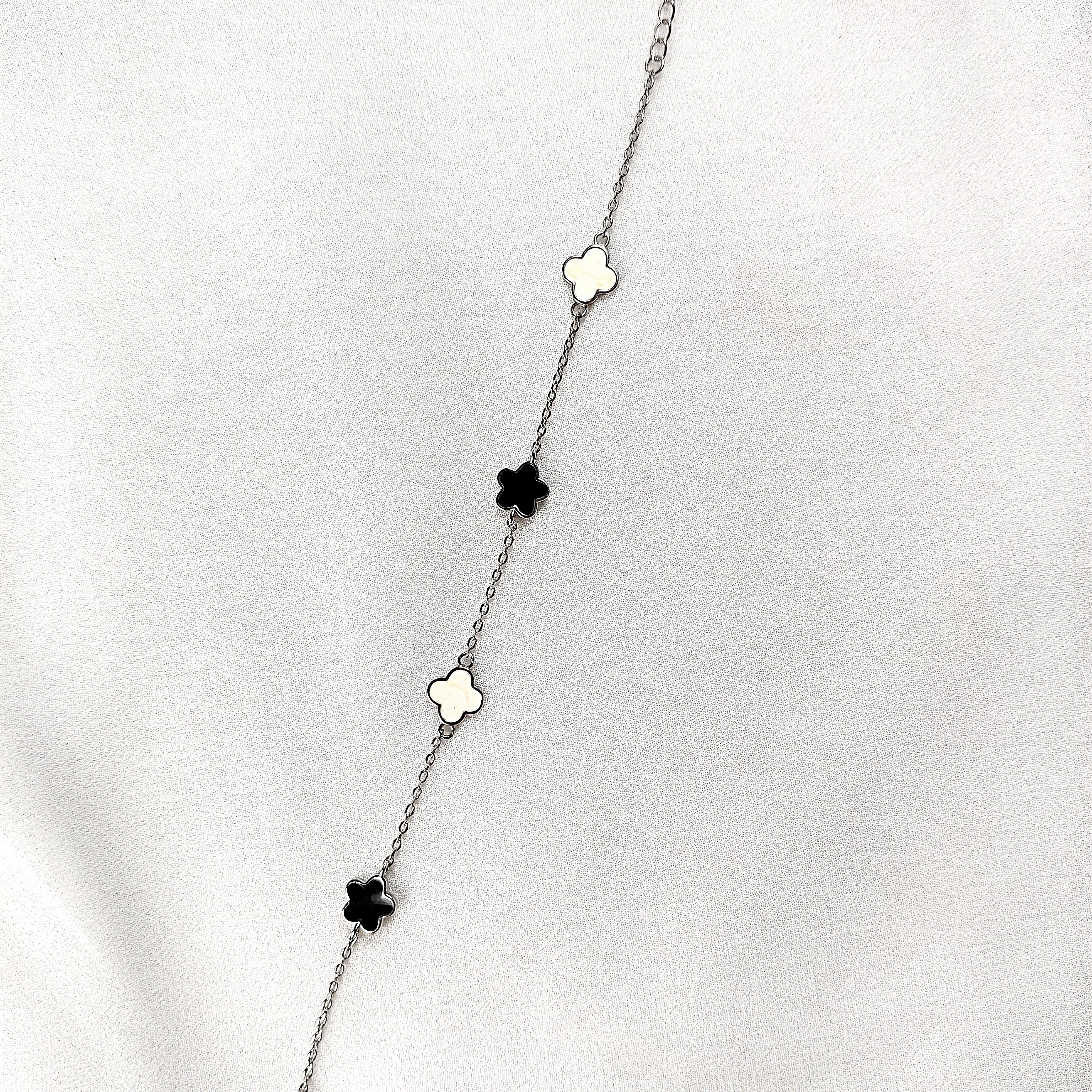 Gourmette en Argent 925 Trèfles Nacre et Onyx Gourmette en Argent 925 Trèfles Nacre et Onyx
