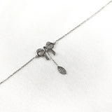 Gourmette en Argent 925 avec Noeud Papillon et Pendentif Goutte Gourmette en Argent 925 avec Noeud Papillon et Pendentif Goutte