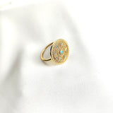 Bague en plaqué or motif mandala avec pierres turquoise Bague en plaqué or motif mandala avec pierres turquoise
