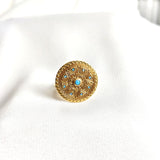 Bague en plaqué or motif mandala avec pierres turquoise Bague en plaqué or motif mandala avec pierres turquoise