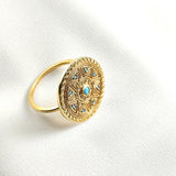 Bague en plaqué or motif mandala avec pierres turquoise Bague en plaqué or motif mandala avec pierres turquoise