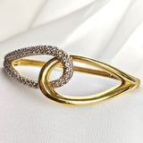 Bracelet en plaqué or design entrelacé avec zircons scintillants Bracelet en plaqué or design entrelacé avec zircons scintillants