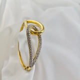 Bracelet en plaqué or design entrelacé avec zircons scintillants Bracelet en plaqué or design entrelacé avec zircons scintillants
