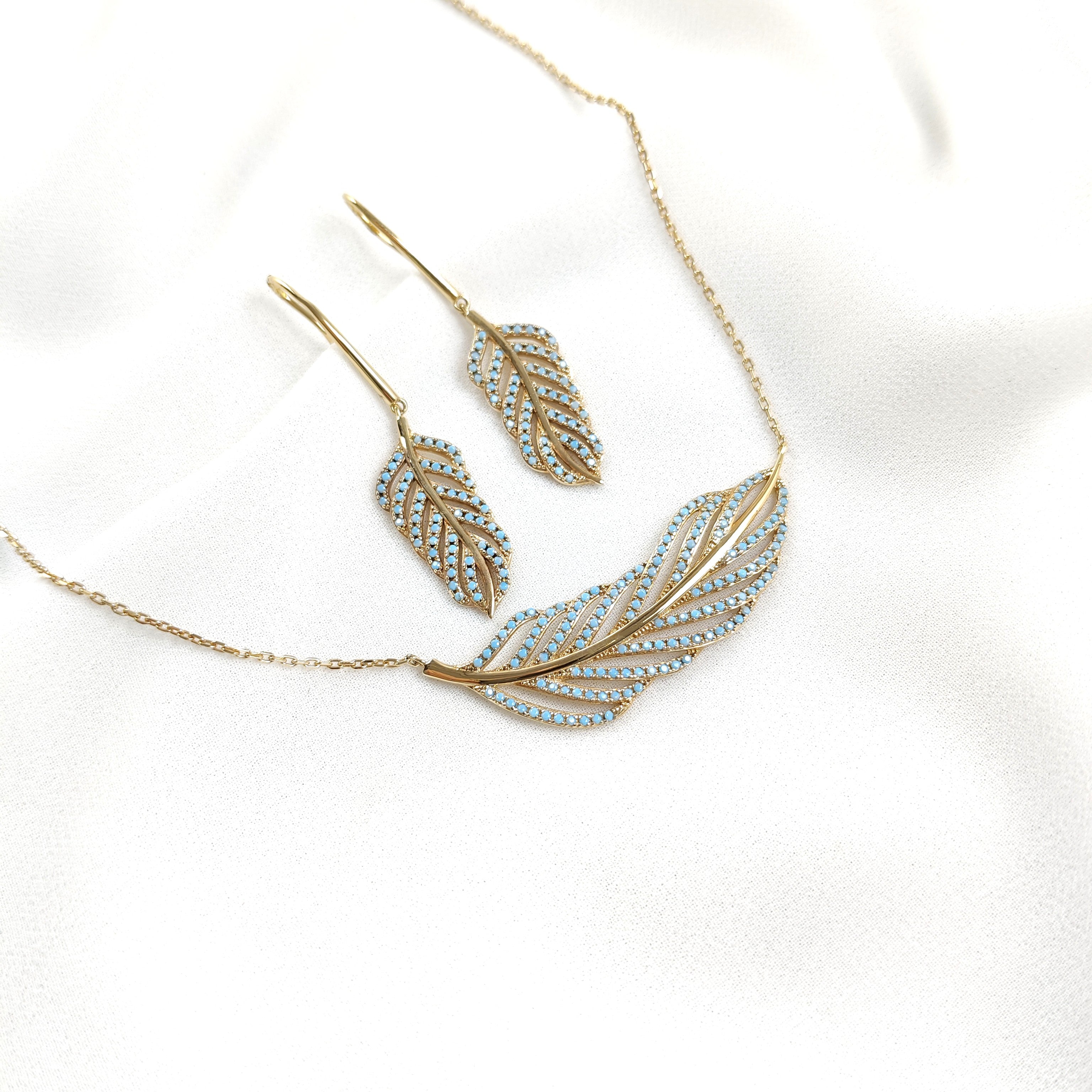 Parure en plaqué or avec zircon bleu  en forme de plume Parure en plaqué or avec zircon bleu  en forme de plume