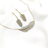 Parure en plaqué or avec zircon bleu  en forme de plume Parure en plaqué or avec zircon bleu  en forme de plume