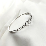 Bracelet en argent sterling avec anneaux entrelacés et zirconium Bracelet en argent sterling avec anneaux entrelacés et zirconium