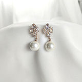 Boucles d’oreilles fantaisie perles et cristaux scintillants Boucles d’oreilles fantaisie perles et cristaux scintillants