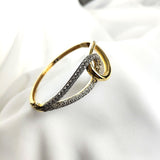Bracelet en plaqué or design entrelacé avec zircons scintillants