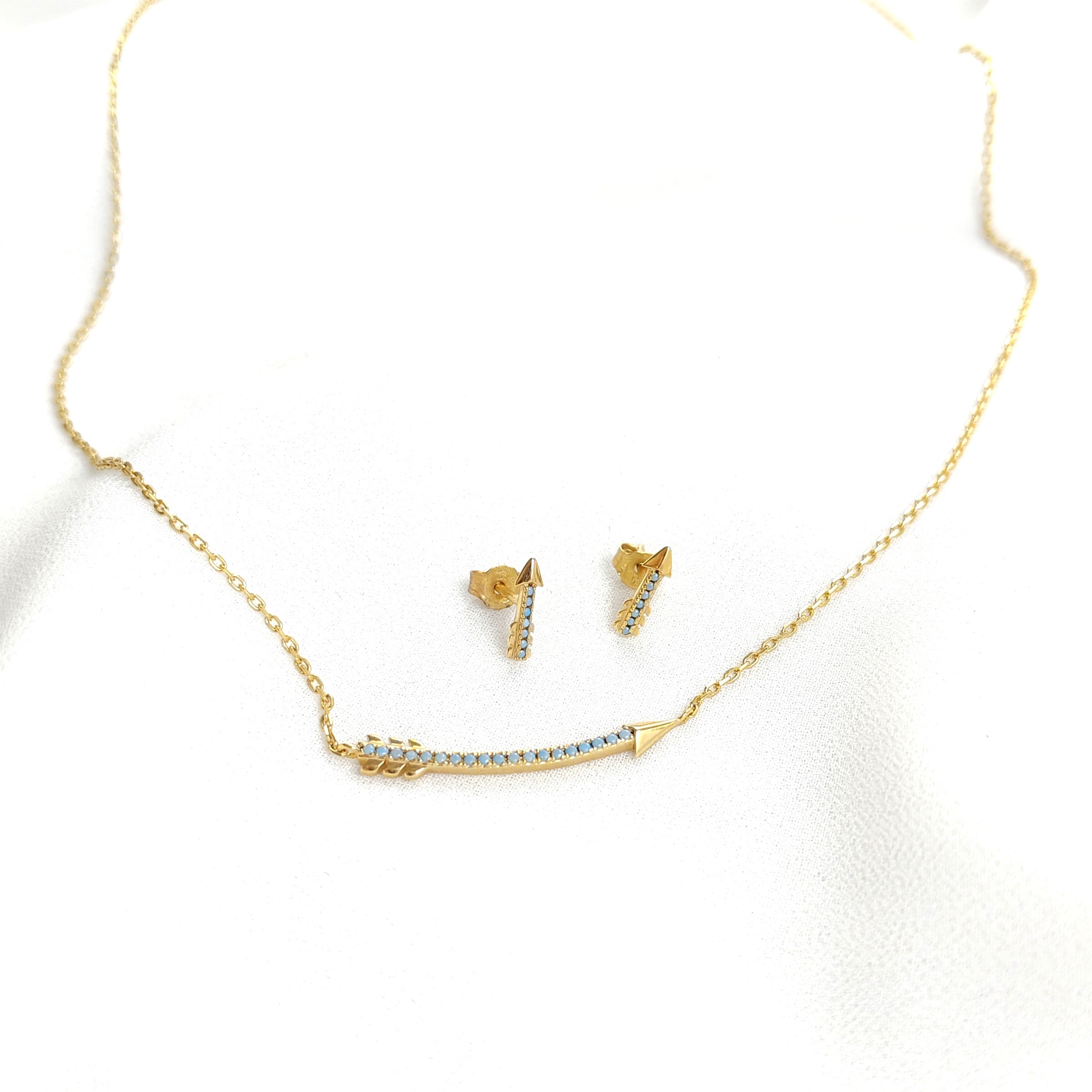 Parure en plaqué or flèche avec pierres turquoise