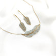 Parure en plaqué or avec zircon bleu  en forme de plume