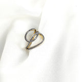 Bague en plaqué or design entrelacé pavée de zircons