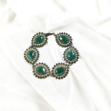 Gourmette antique en bronze et pierres vertes