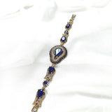 Gourmette antique en bronze avec pierres bleues royales