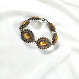 Gourmette en bronze – Élégance impériale aux pierres dorées