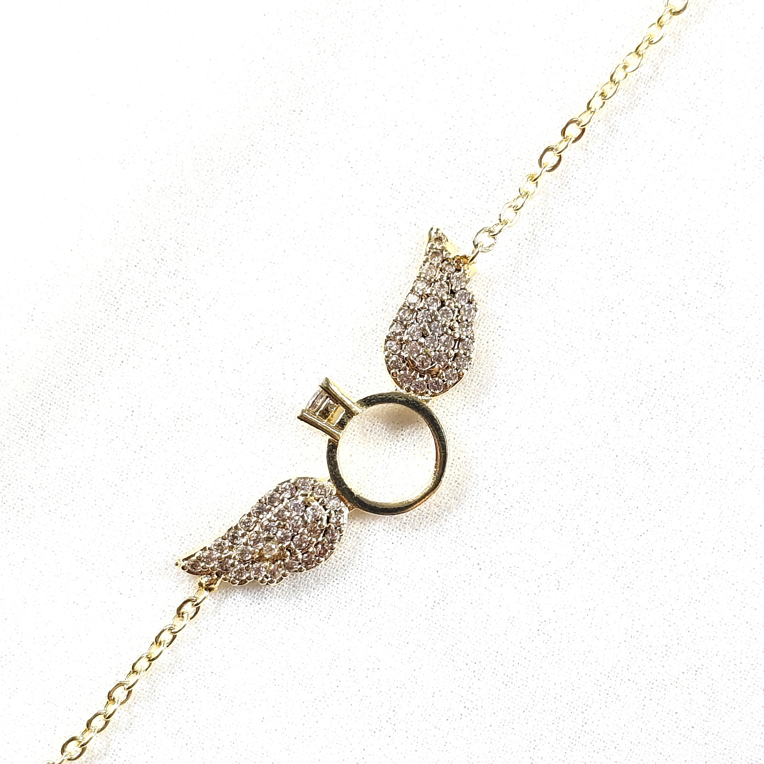 Bracelet Fantaisie Doré “Bague Ailée” Strassée