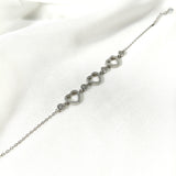 Gourmette Cœurs Scintillants en Argent – Romance & Raffinement