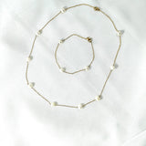 Parure en Acier Inoxydable Doré avec Perles Blanches