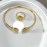 Parure Élégance Dorée – Bracelet Jonc & Bague Nœud Chic