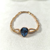 Bracelet élégant en xuping plaqué or avec cristal Swarovski bleu en goutte