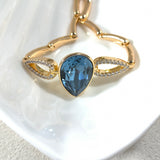 Bracelet élégant en xuping plaqué or avec cristal Swarovski bleu en goutte